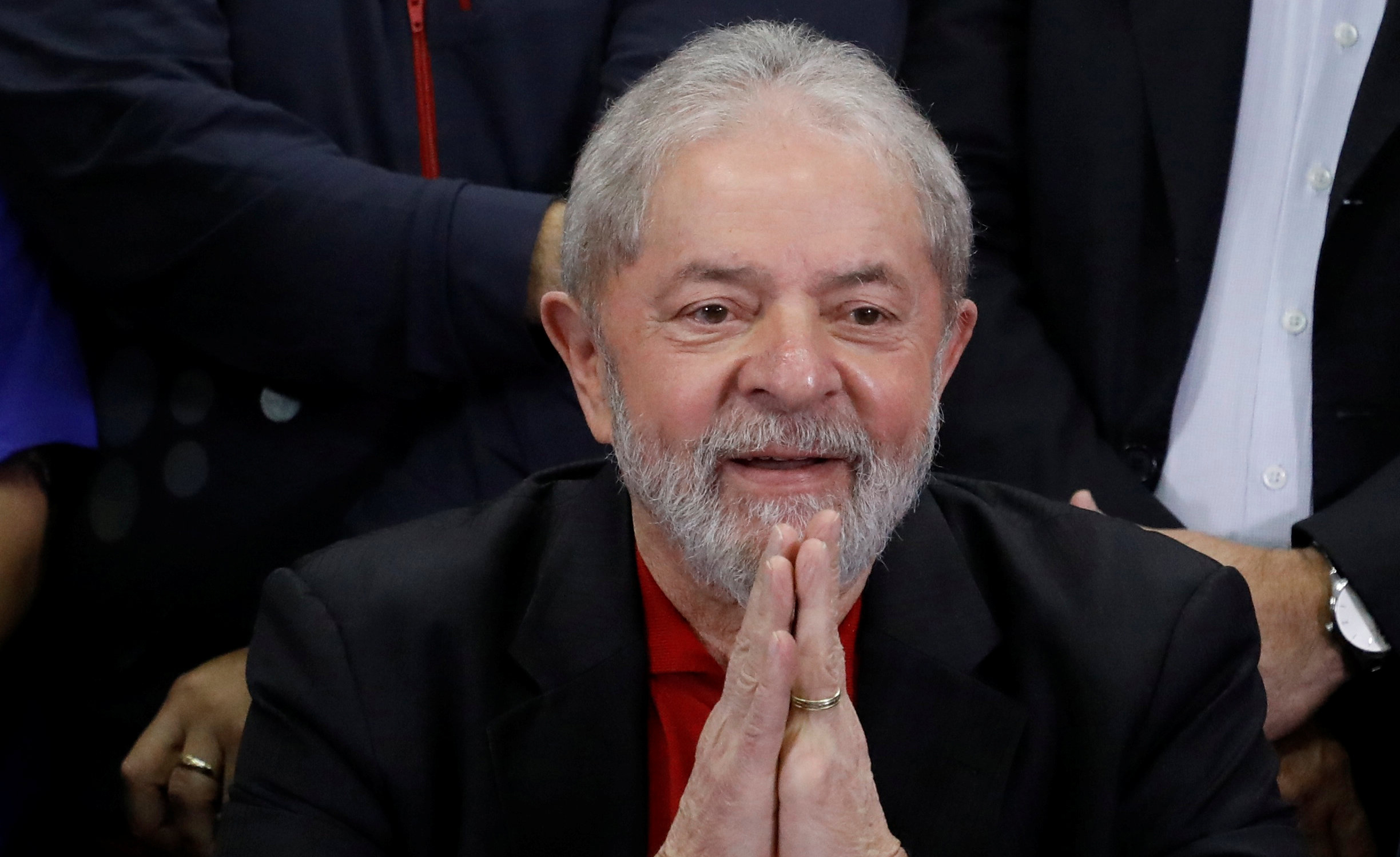 Former Brazilian President Luiz Inacio Lula da Silva gestures during a news conference after being convicted on corruption charges, in Sao Paulo